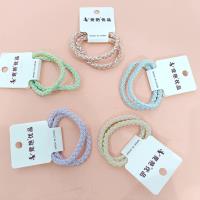 2 candy-colored pretzel-shaped braided headbands