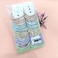 2 candy-colored pretzel-shaped braided headbands