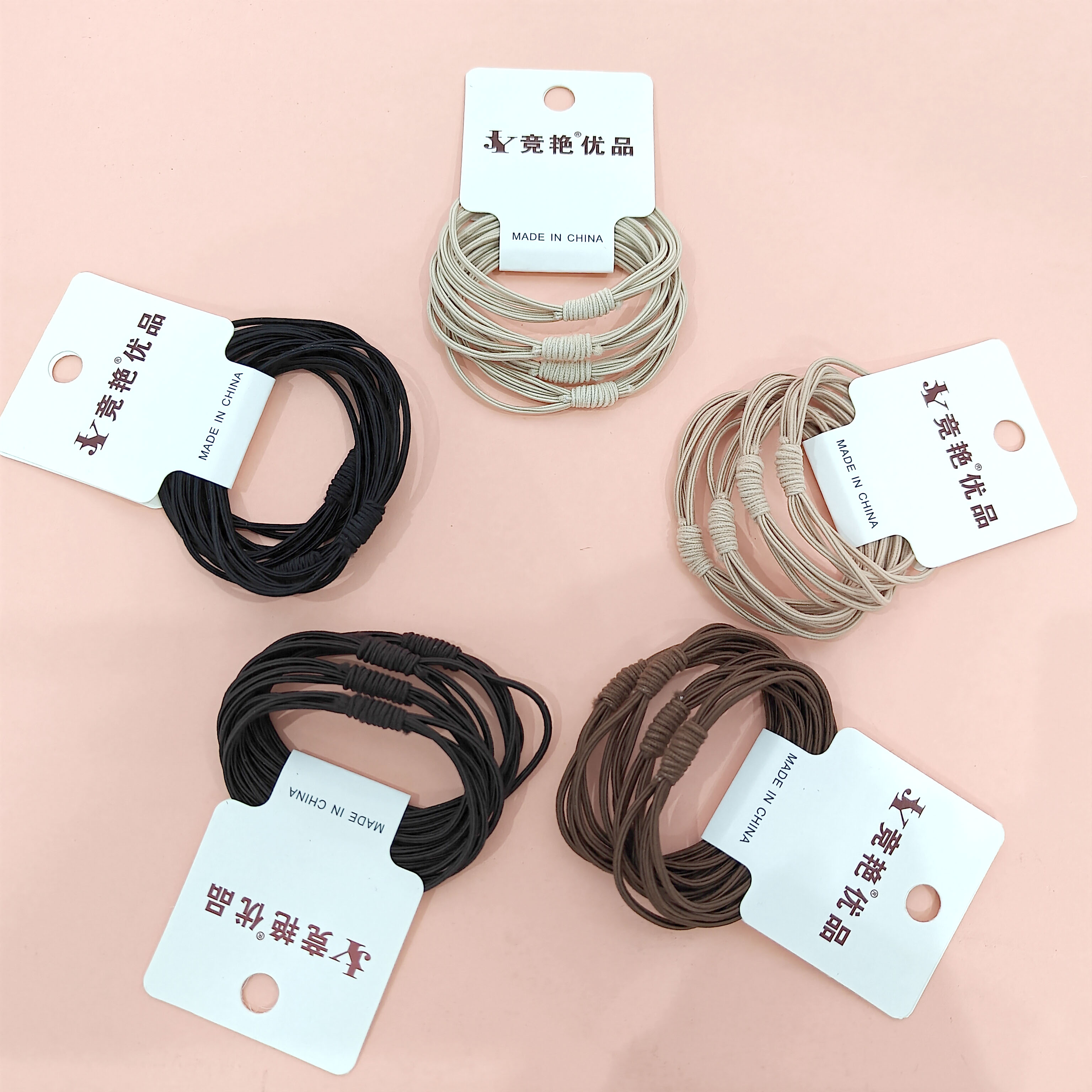 4 pairs of versatile rubber bands in earth-tone colors, featuring a bee design