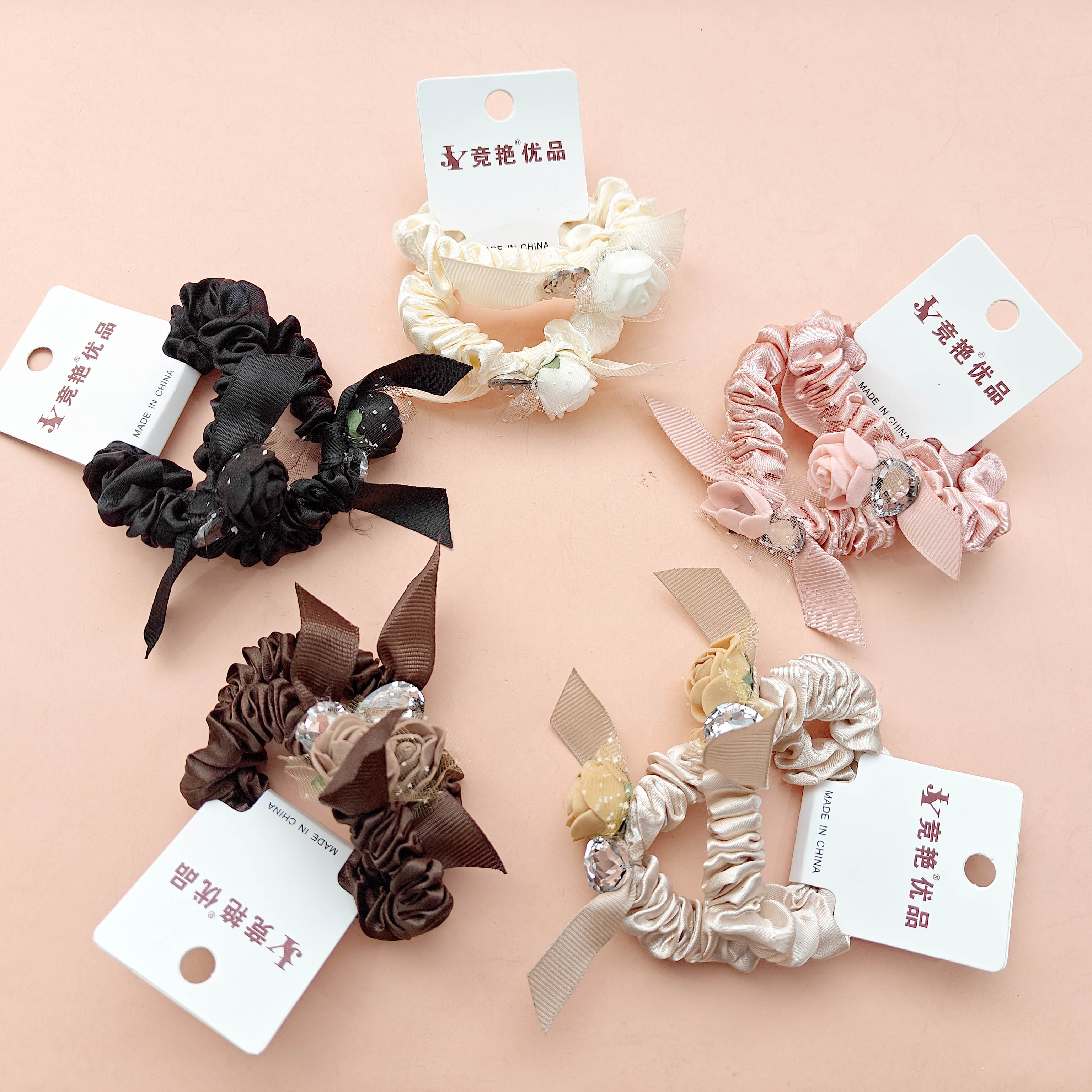 2 pairs of small elastic hair ties decorated with 3D roses