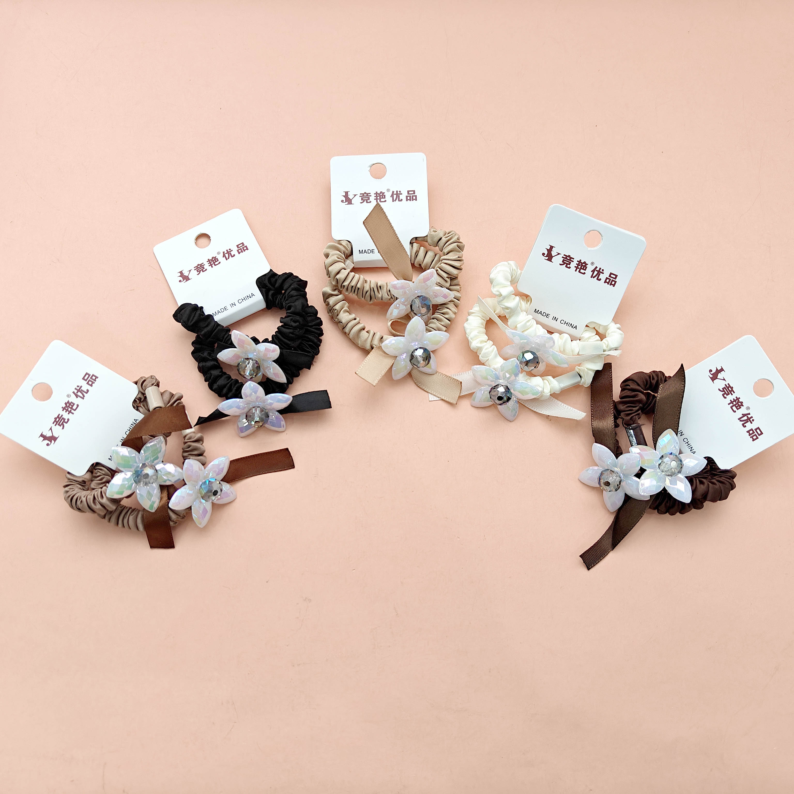 2 pieces of rubber bands decorated with delicate flowers