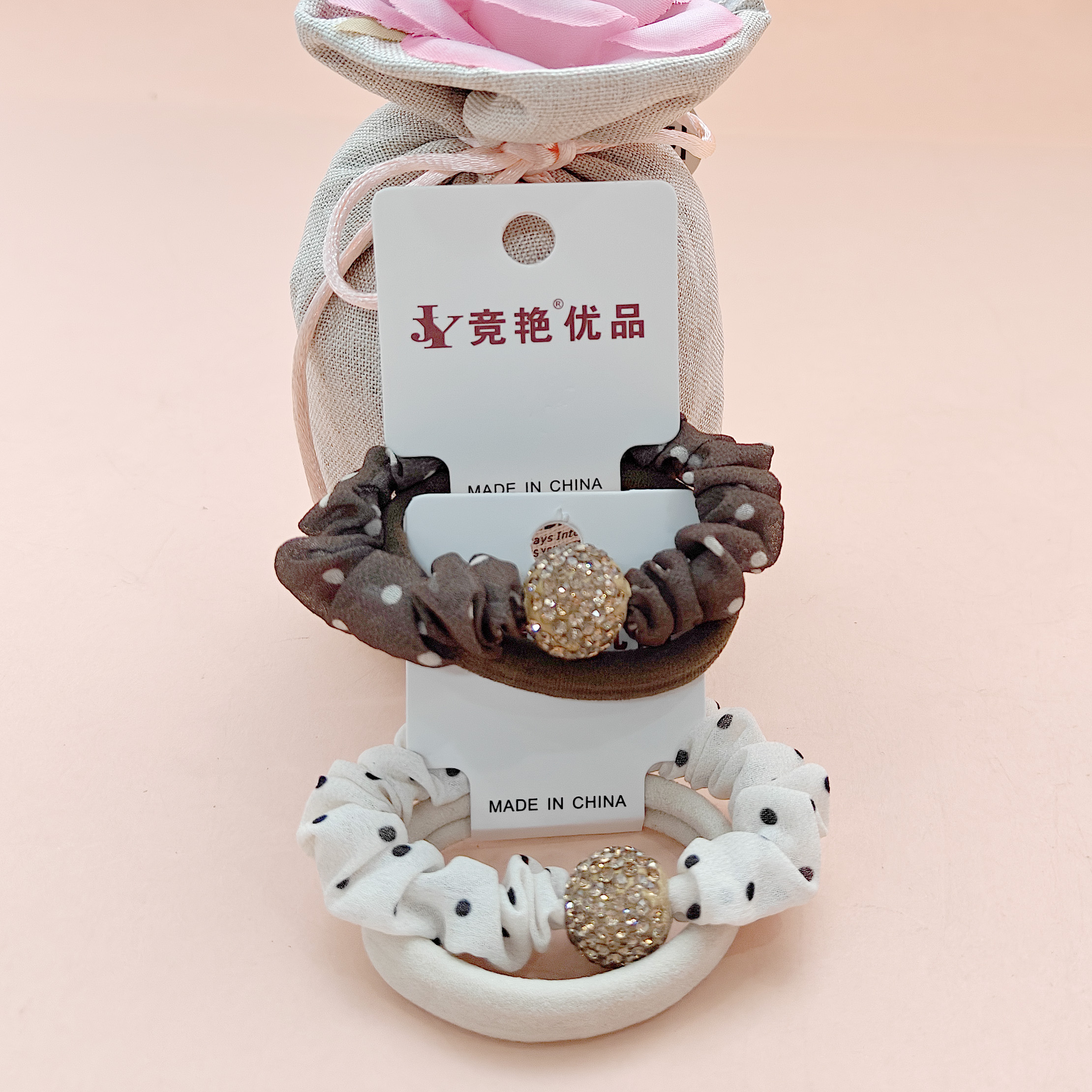 A two-piece set with two round-cut diamond pendants