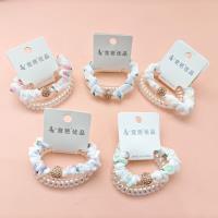 2 pieces of phone line decorative ribbons with round and sparkling diamonds on them