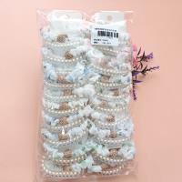 2 pieces of phone line decorative ribbons with round and sparkling diamonds on them