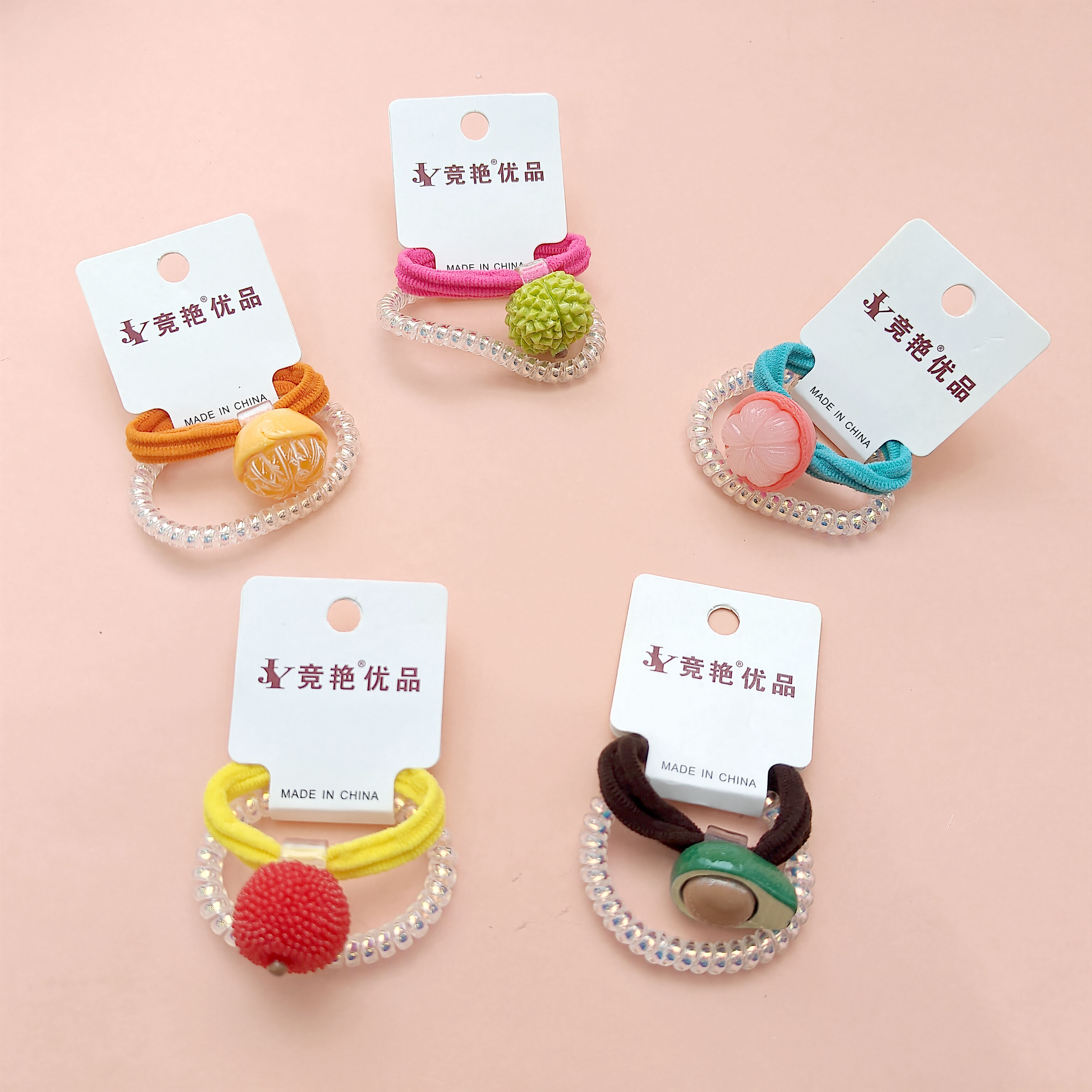 2 pieces of phone cord with fruit-themed designs