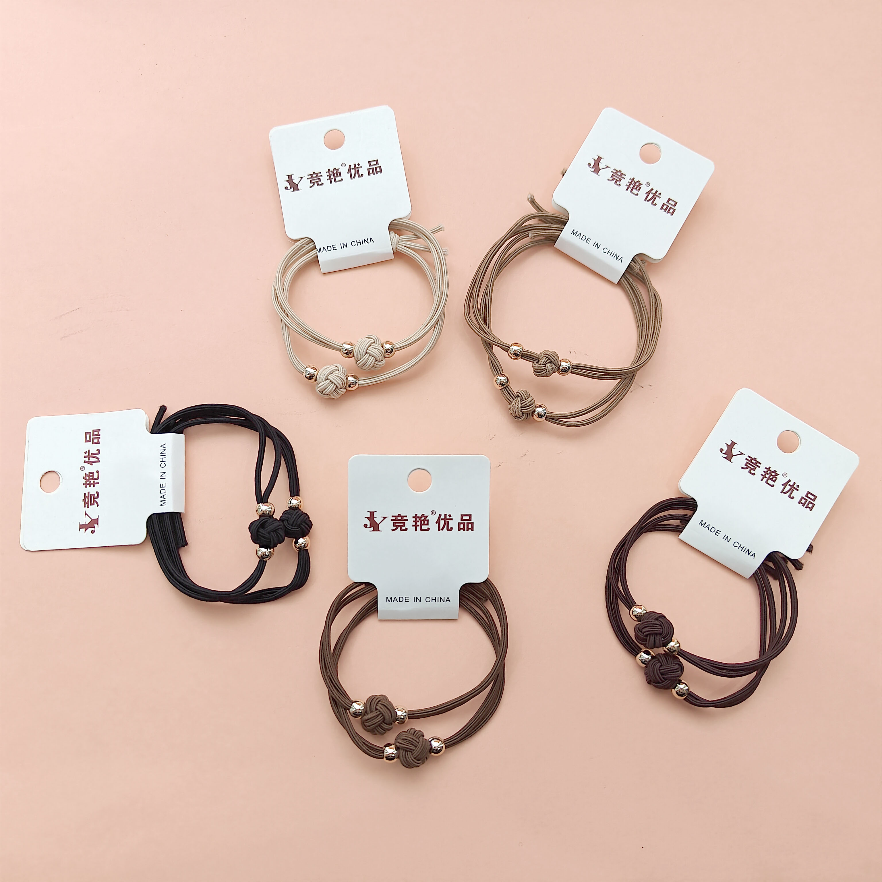 2 pieces of lucky flower-patterned headbands in earth tones