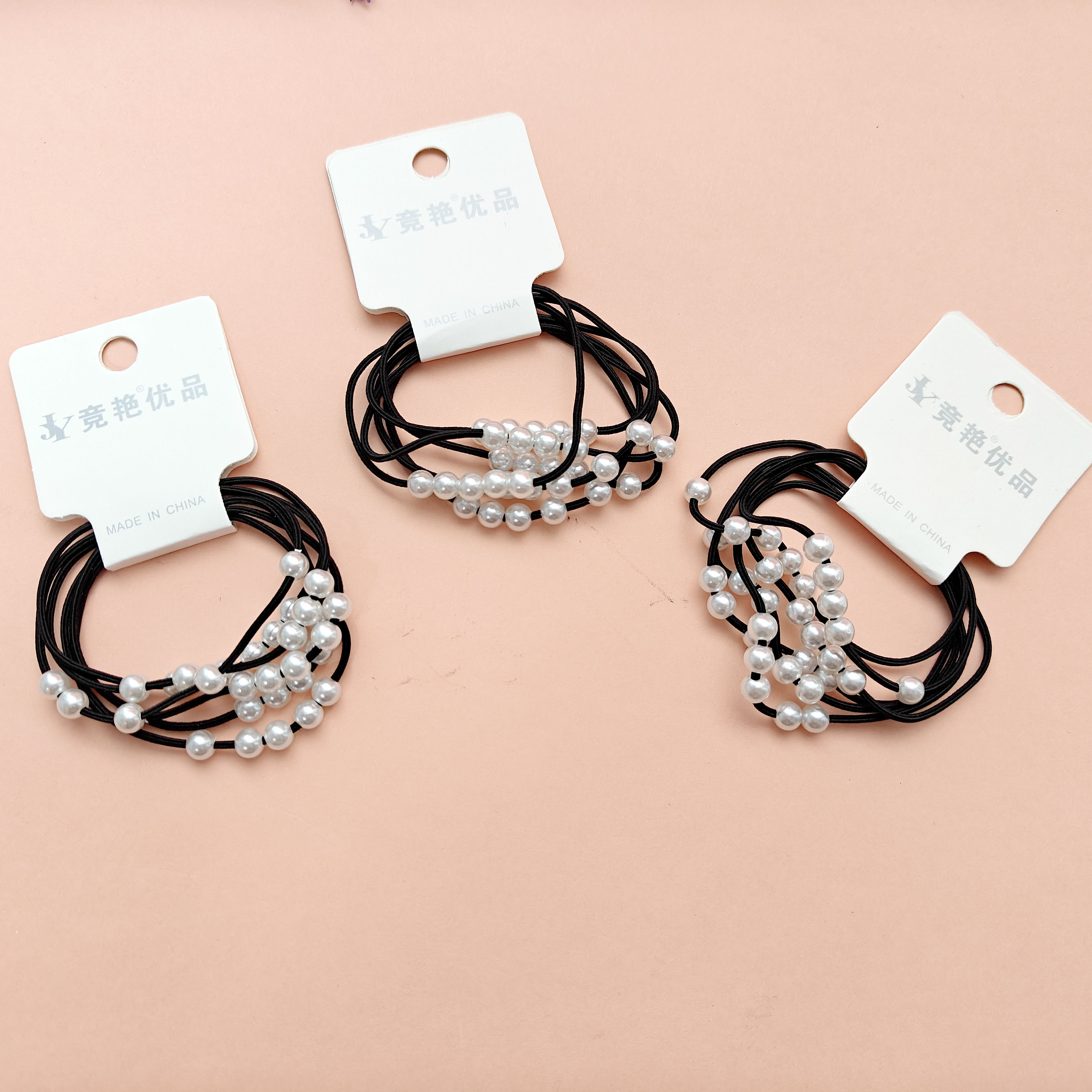 2 black multi-strand pearl headbands