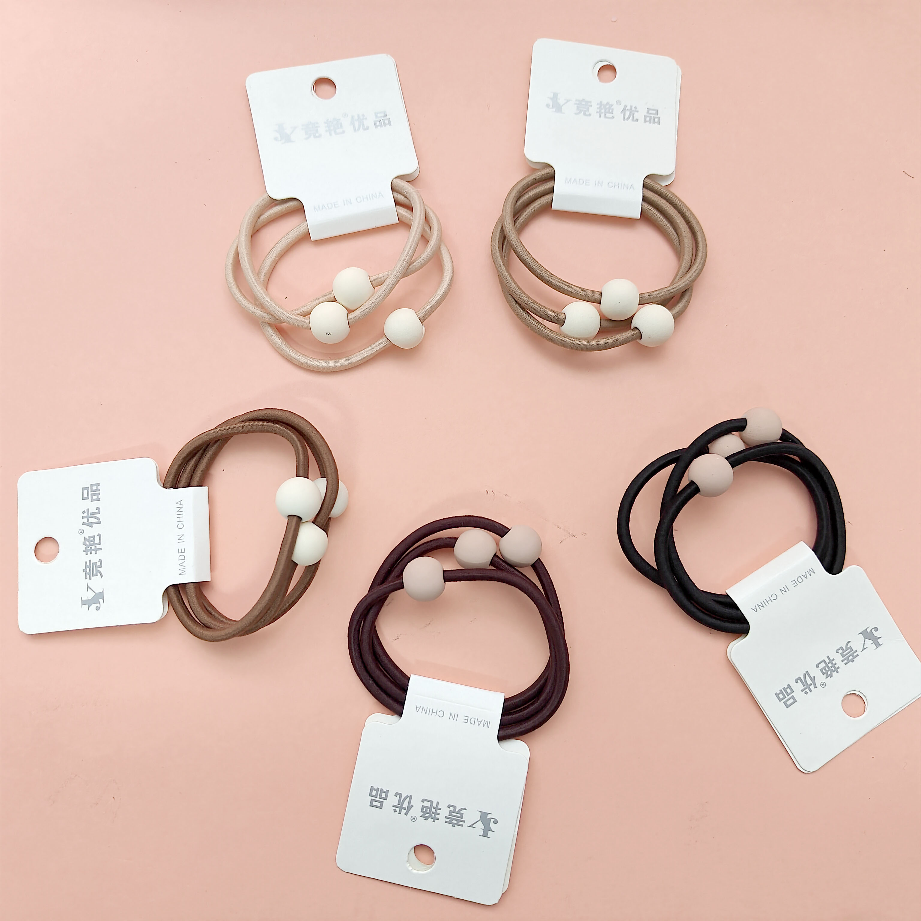 3 packs of chocolate bead hair ties dyed with earth-tone pigments