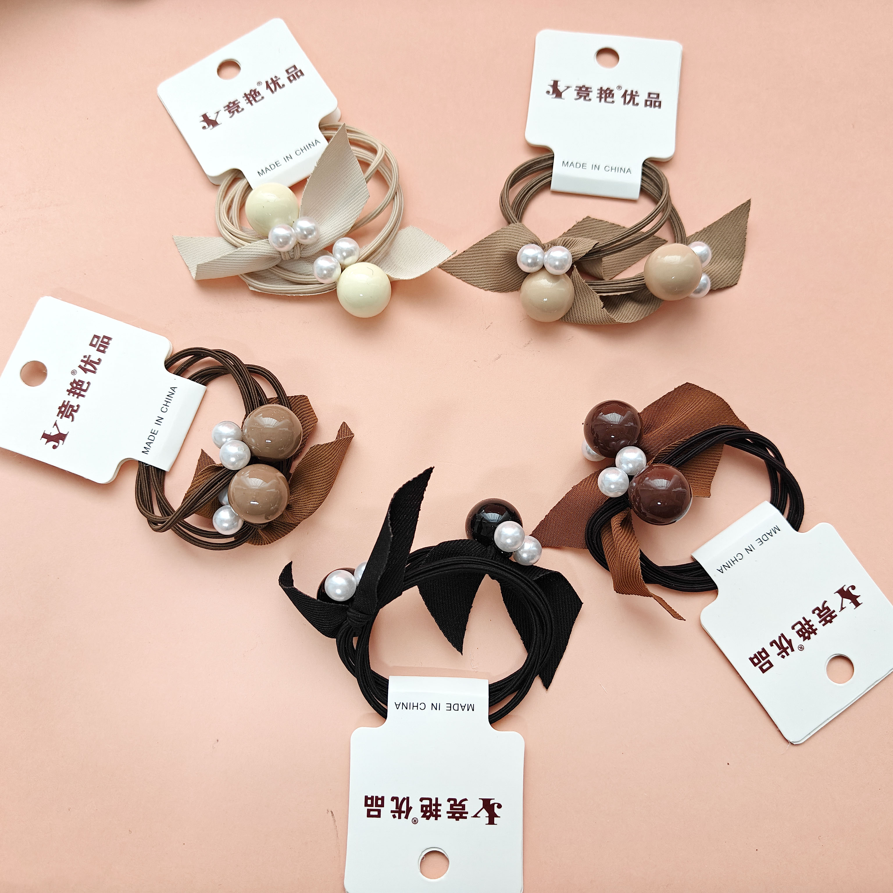 2 pieces of string for tying up hairballs in earth tones