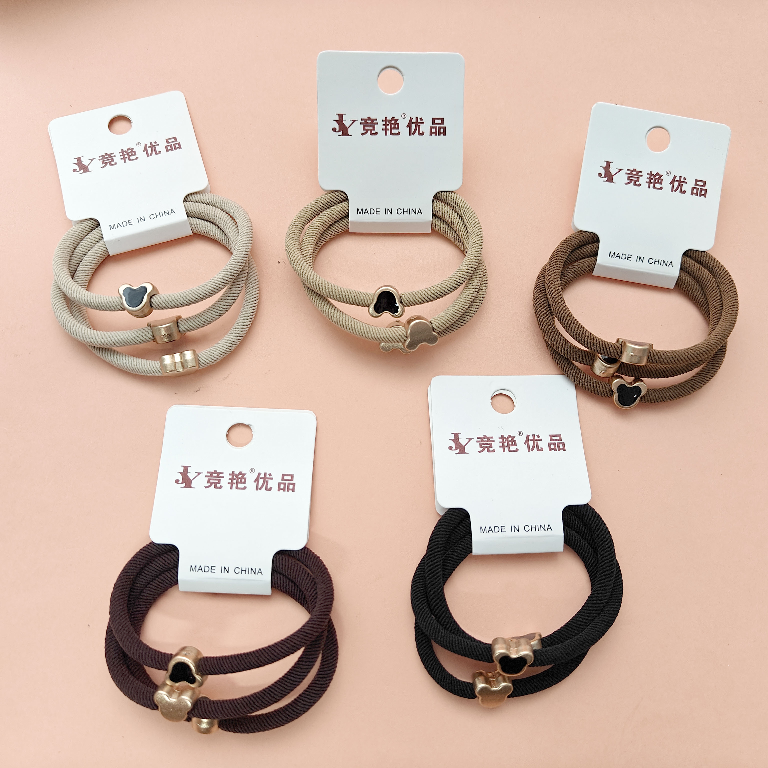 3 pairs of heart-shaped, earth-tone screw-top bracelets