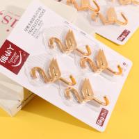 YL9319 - Quatre crochets adhésifs en forme d'oies dorées.