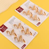 YL9319 - Quatre crochets adhésifs en forme d'oies dorées.