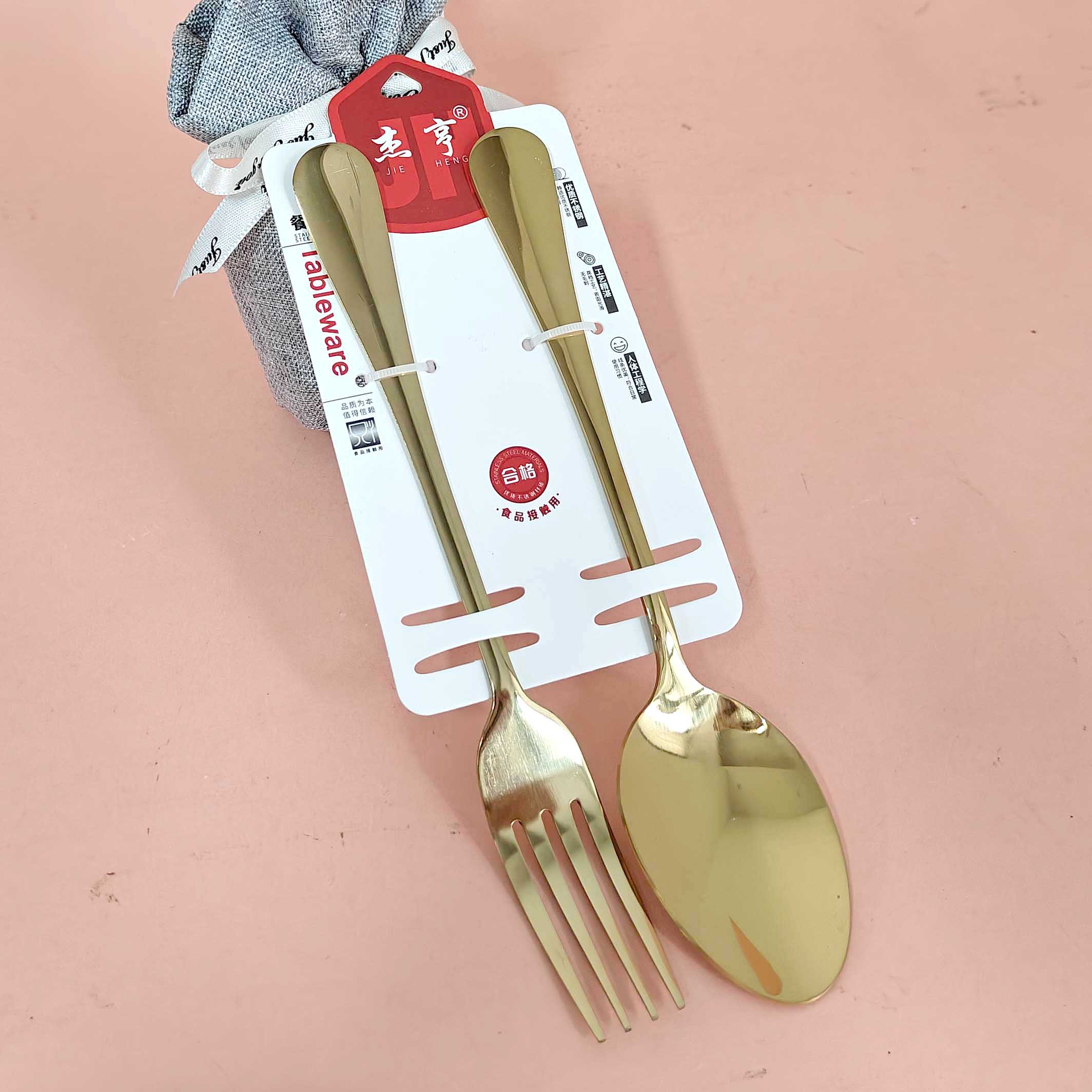 A gold-plated thick-handled No. 1 pointed spoon and No. 1 fork set