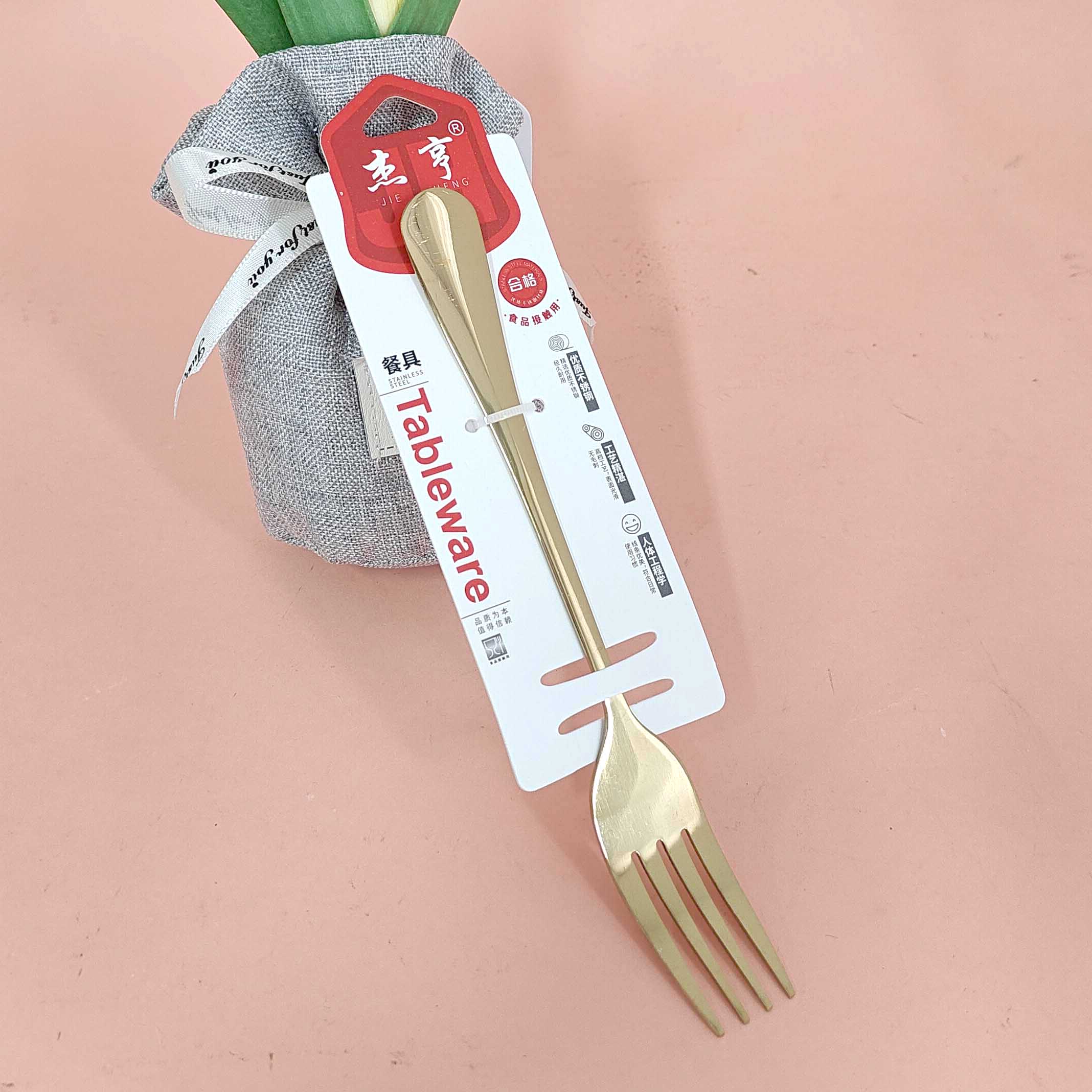 A gold-plated fork with a thick handle, model number 2