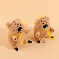 A large plush brown bear pendant