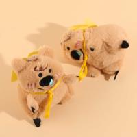 A large plush brown bear pendant