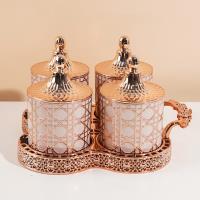 مجموعة علب التخزين الصغيرة المغلقة من ديور بلون الوردي والذهبي.