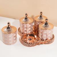 مجموعة علب التخزين الصغيرة المغلقة من ديور بلون الوردي والذهبي.