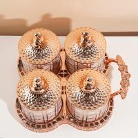 مجموعة علب التخزين الصغيرة المغلقة من ديور بلون الوردي والذهبي.