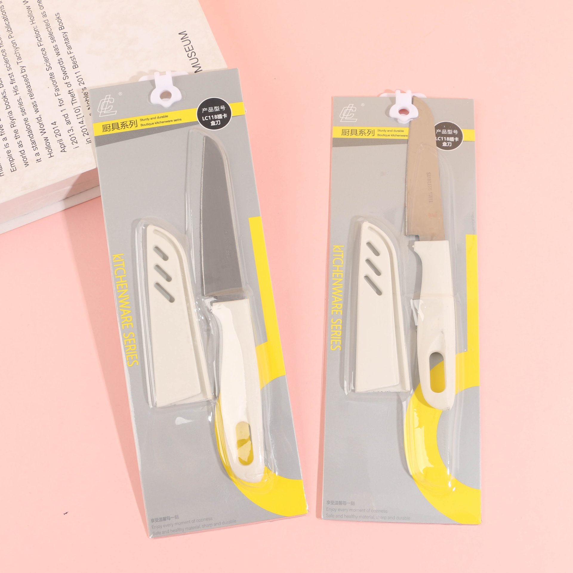 The LC118 card slot knife, featuring a yellow and silver card design.